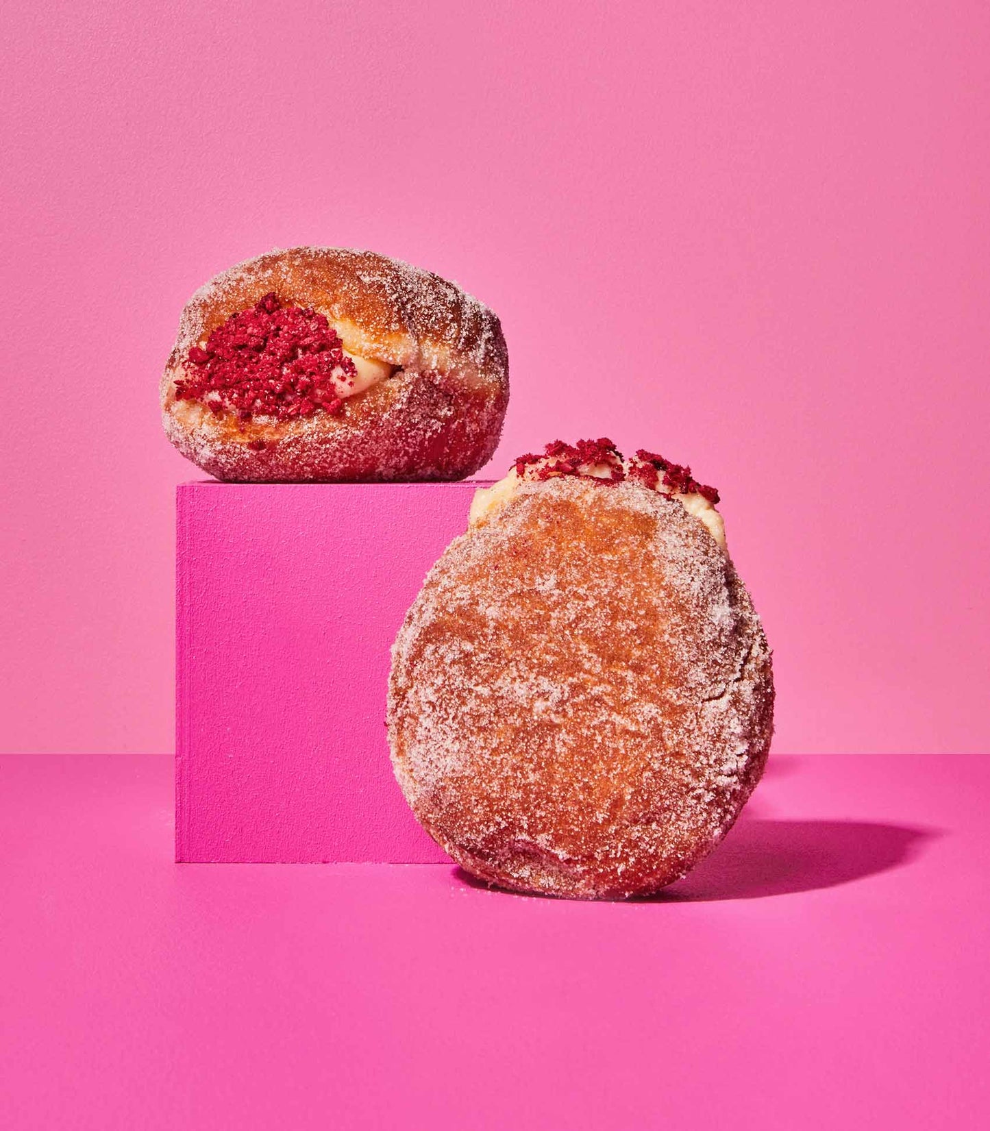 DOE Donuts 2 donuts on a pink cube with jam and cream fillings
