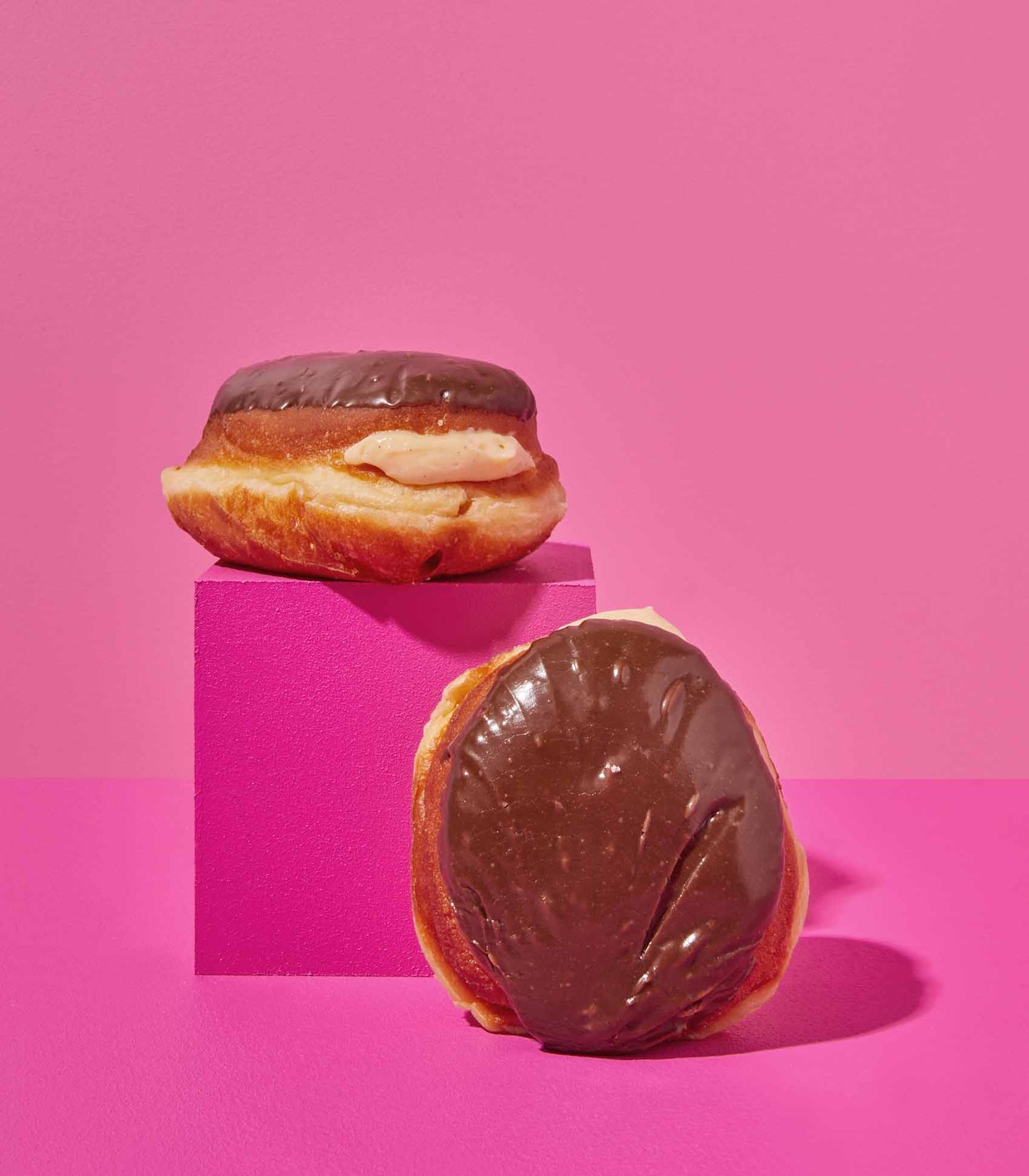 DOE Donuts 2 on pink cubes weekly special Boston Creme flavour