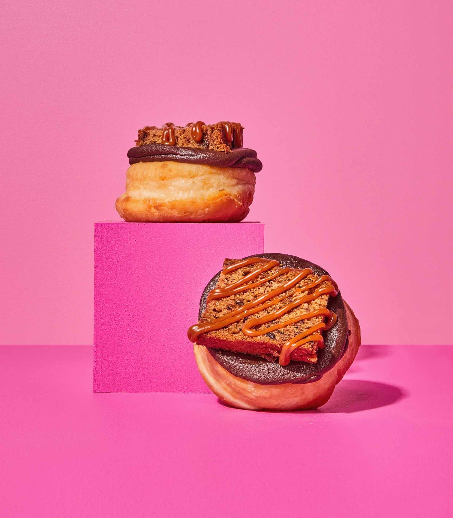 DOE Donuts weekly special Banana cake stacked on a pink cube